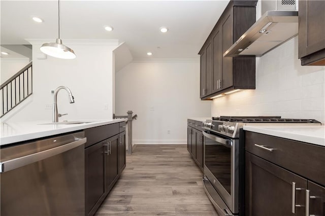 362 Olmstead Way Unit 23, Alpharetta, GA 30022 - kitchen featuring appliances with stainless steel finishes, wall chimney range hood, crown molding, dark brown cabinets, and light countertops