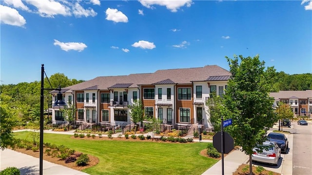 362 Olmstead Way Unit 23, Alpharetta, GA 30022 - view of front facade with a standing seam roof, a metal roof, a front yard, and a residential view