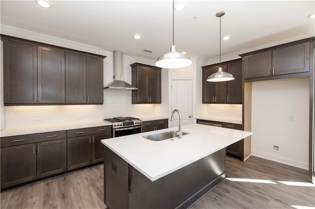 362 Olmstead Way Unit 23, Alpharetta, GA 30022 - kitchen featuring wall chimney exhaust hood, stainless steel gas range oven, wood finished floors, dark brown cabinetry, and backsplash