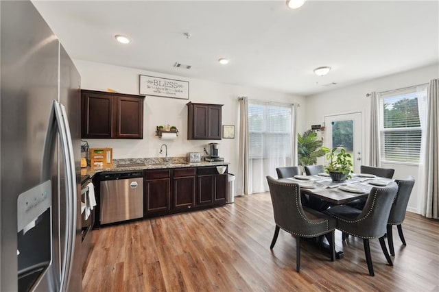 2051 Wildflower Way, Conyers, GA 30012 - dining space featuring recessed lighting, light wood-style floors, a healthy amount of sunlight, and visible vents