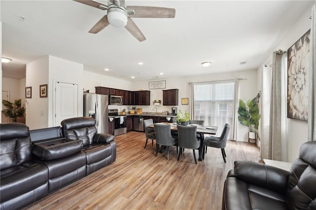 2051 Wildflower Way, Conyers, GA 30012 - living area featuring ceiling fan, recessed lighting, and light wood-type flooring