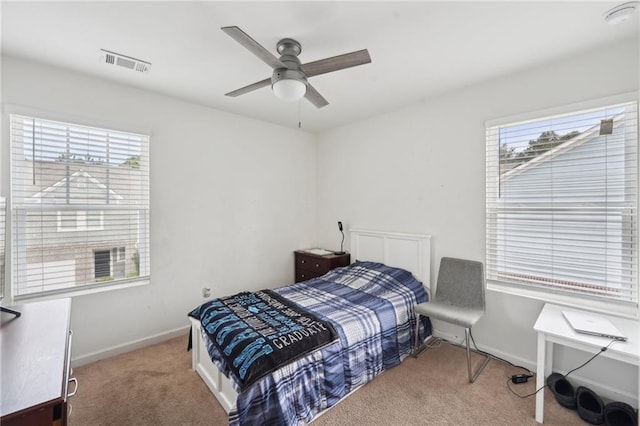 2051 Wildflower Way, Conyers, GA 30012 - carpeted bedroom with ceiling fan, baseboards, and visible vents