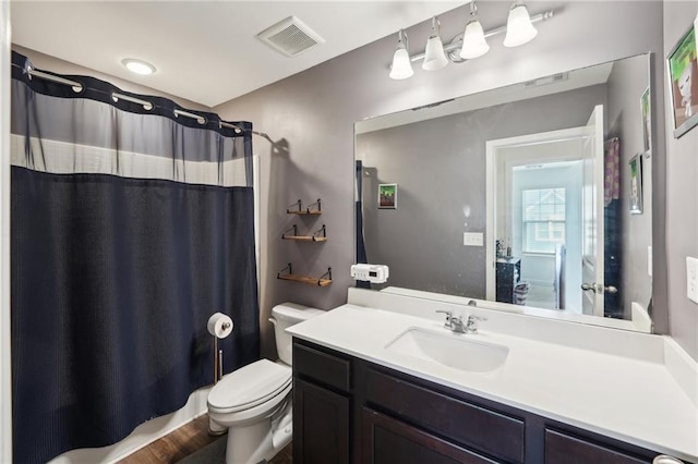 2051 Wildflower Way, Conyers, GA 30012 - bathroom with shower / tub combo, visible vents, vanity, and toilet