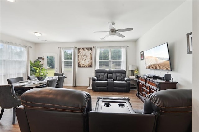 2051 Wildflower Way, Conyers, GA 30012 - living room featuring ceiling fan, baseboards, and wood finished floors