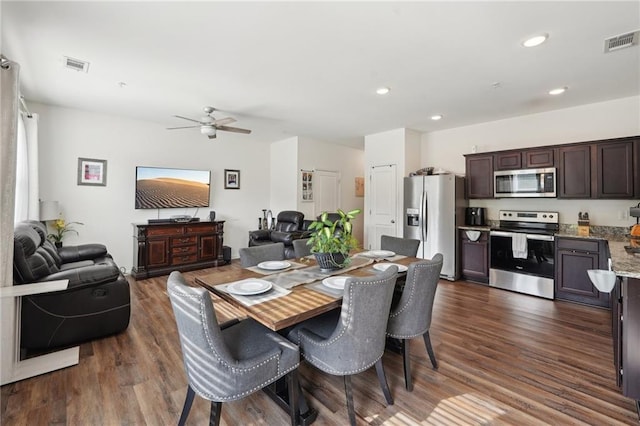 2051 Wildflower Way, Conyers, GA 30012 - dining area with visible vents, dark wood-style floors, and ceiling fan