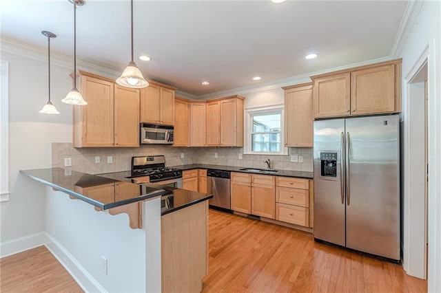 3404 Orchard St, Hapeville, GA 30354 - kitchen with appliances with stainless steel finishes, light brown cabinetry, a peninsula, dark countertops, and ornamental molding