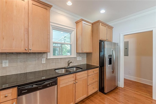 3404 Orchard St, Hapeville, GA 30354 - kitchen with appliances with stainless steel finishes, crown molding, light brown cabinets, electric panel, and light wood-style floors