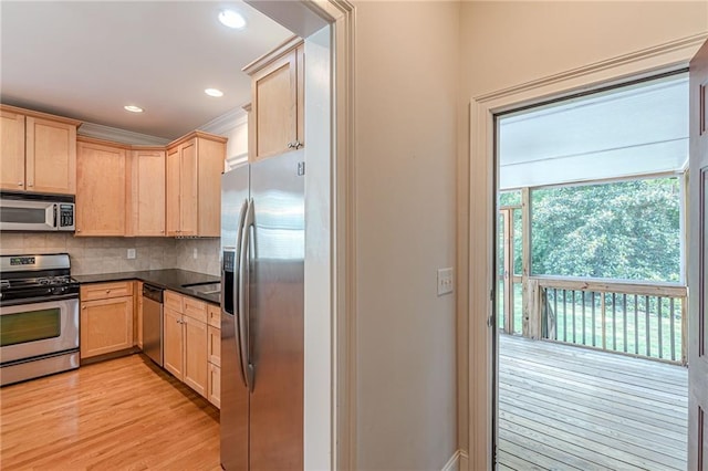 3404 Orchard St, Hapeville, GA 30354 - kitchen featuring stainless steel appliances, light brown cabinetry, dark countertops, light wood-style flooring, and recessed lighting