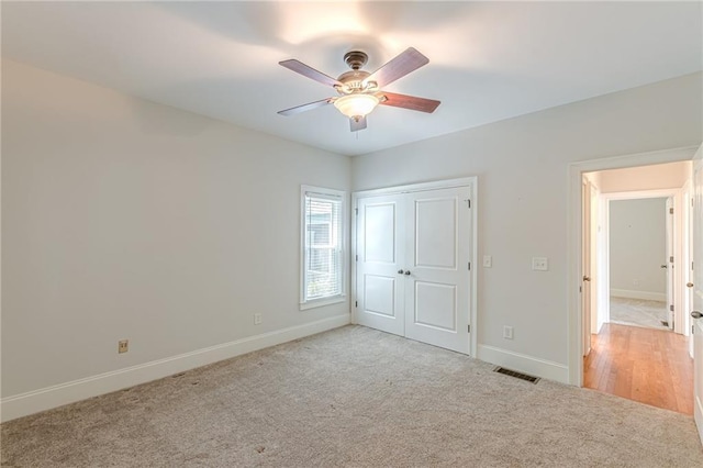 3404 Orchard St, Hapeville, GA 30354 - unfurnished bedroom featuring light carpet, a closet, and ceiling fan