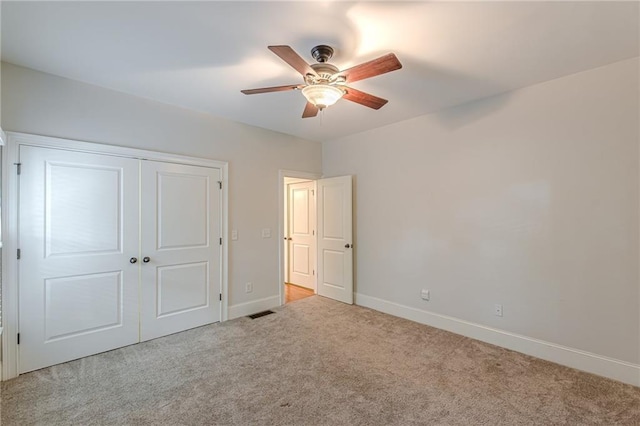 3404 Orchard St, Hapeville, GA 30354 - unfurnished bedroom with carpet, a closet, and a ceiling fan