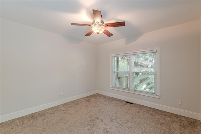 3404 Orchard St, Hapeville, GA 30354 - carpeted empty room with baseboards and a ceiling fan