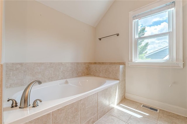 3404 Orchard St, Hapeville, GA 30354 - bathroom with a bath, lofted ceiling, and tile patterned floors