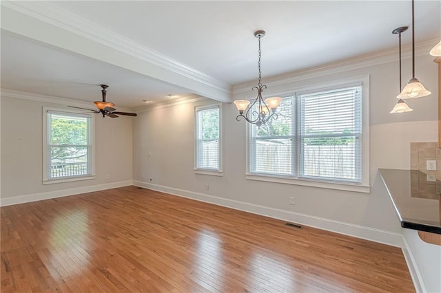 3404 Orchard St, Hapeville, GA 30354 - unfurnished dining area with light wood-style flooring, a chandelier, and ornamental molding