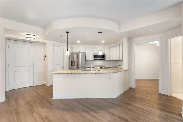 kitchen with recessed lighting, white cabinetry, appliances with stainless steel finishes, backsplash, and baseboards
