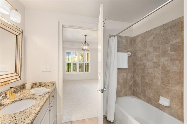 full bathroom featuring vanity, tile patterned floors, and shower / bathtub combination with curtain