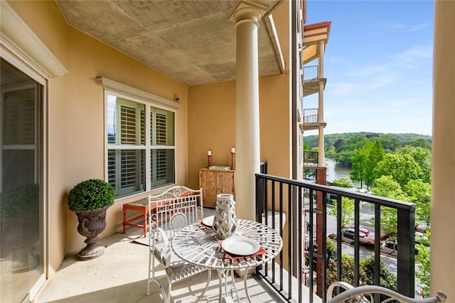 balcony featuring a water view