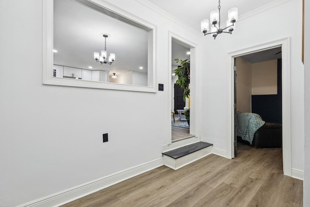 interior space with a chandelier and hardwood / wood-style flooring