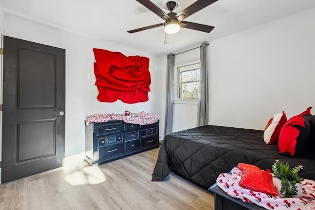 bedroom featuring ceiling fan and light hardwood / wood-style flooring