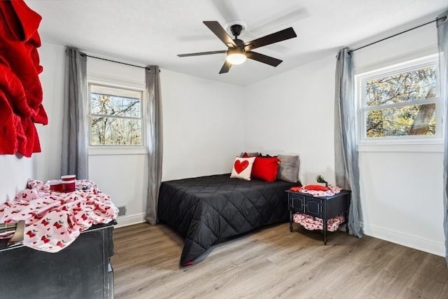 bedroom featuring ceiling fan and light wood-type flooring