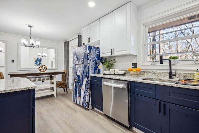 kitchen with a notable chandelier, stainless steel dishwasher, white cabinetry, hanging light fixtures, and light wood-type flooring