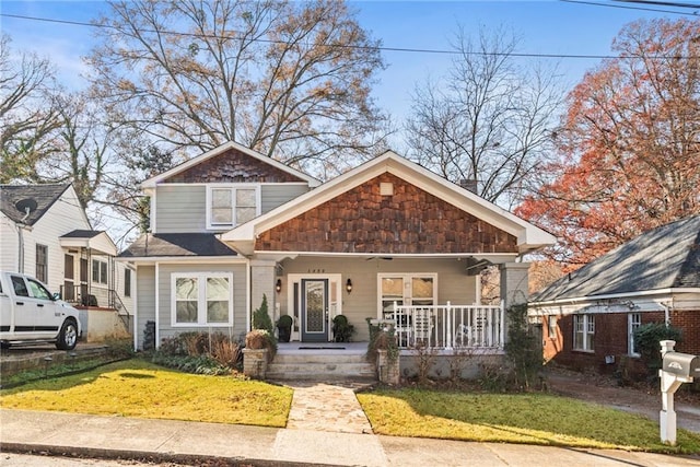 view of front facade with a porch and a front yard