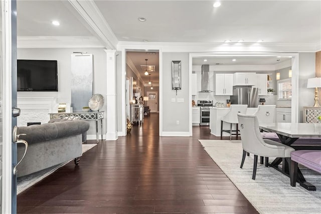 dining area featuring crown molding and dark hardwood / wood-style floors