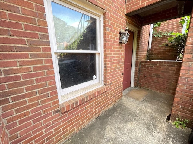 exterior space with brick siding