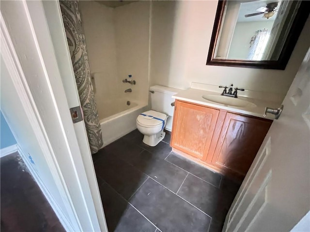 full bath with tile patterned floors, shower / bathtub combination with curtain, vanity, and toilet
