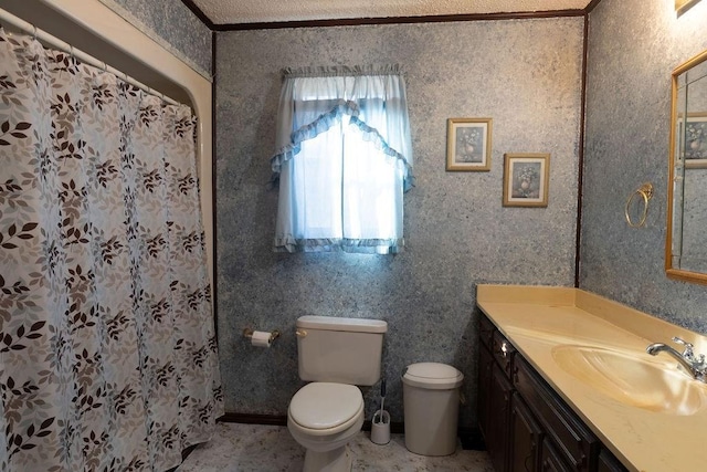 bathroom with ornamental molding, vanity, toilet, and a shower with shower curtain