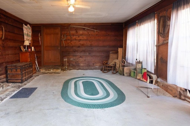 misc room featuring wood walls