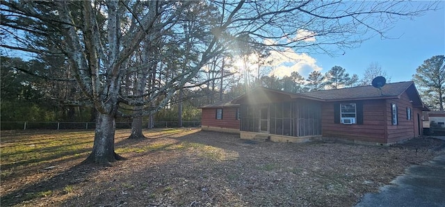 view of side of property with a sunroom