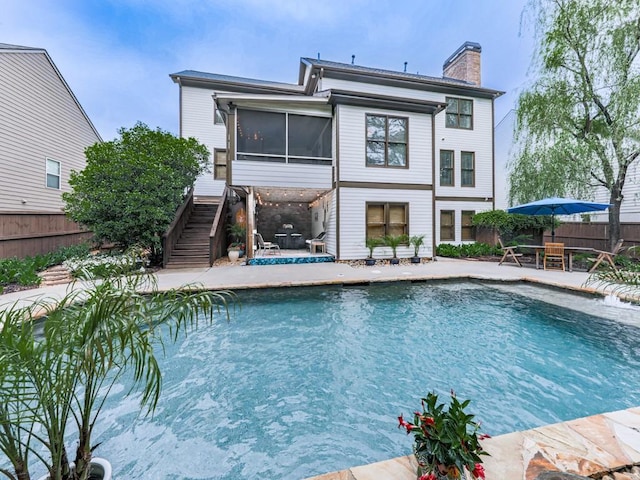 view of swimming pool featuring a fenced backyard