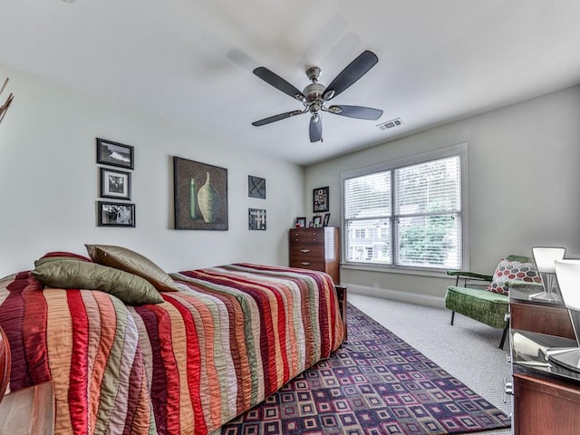 bedroom with carpet, baseboards, and ceiling fan