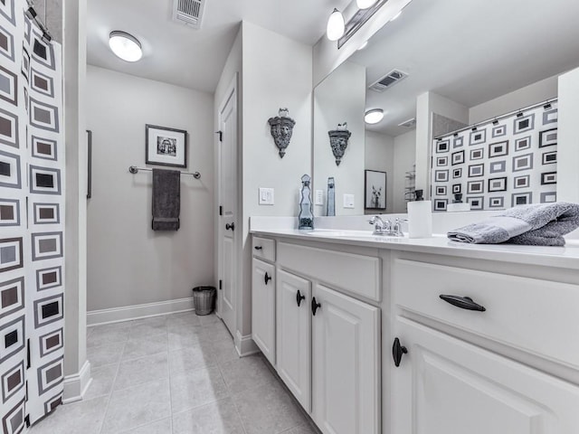 full bath with tile patterned flooring, baseboards, vanity, and a shower with curtain