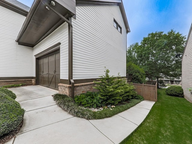 view of side of home with a garage
