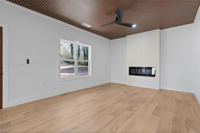 1337 Fairfield Dr, Lilburn, GA 30047 - unfurnished living room featuring a large fireplace, light wood-type flooring, ornamental molding, and ceiling fan