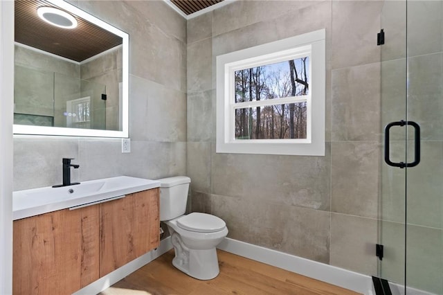 1337 Fairfield Dr, Lilburn, GA 30047 - full bathroom with wood finished floors, vanity, and a stall shower
