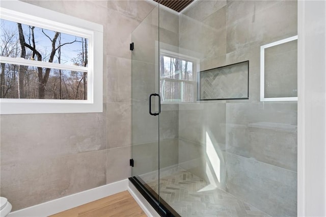 1337 Fairfield Dr, Lilburn, GA 30047 - full bath featuring a shower stall and wood finished floors
