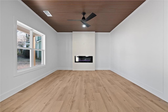 1337 Fairfield Dr, Lilburn, GA 30047 - unfurnished living room with wooden ceiling, crown molding, a fireplace, ceiling fan, and light wood-style flooring