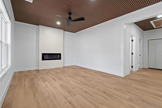 1337 Fairfield Dr, Lilburn, GA 30047 - unfurnished living room featuring a ceiling fan, ornamental molding, wood finished floors, a glass covered fireplace, and recessed lighting