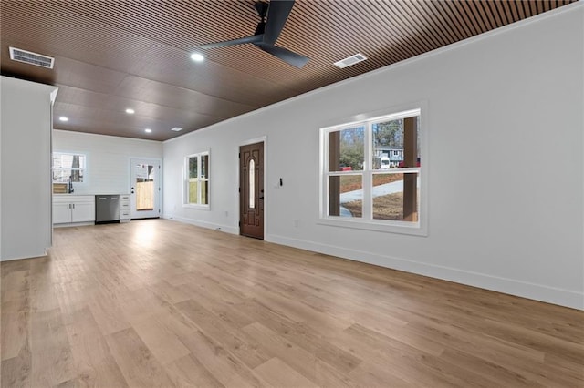 1337 Fairfield Dr, Lilburn, GA 30047 - unfurnished living room with plenty of natural light, recessed lighting, light wood-style floors, and crown molding