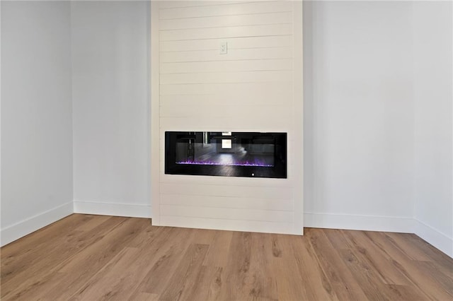 1337 Fairfield Dr, Lilburn, GA 30047 - detailed view of wood finished floors and a glass covered fireplace