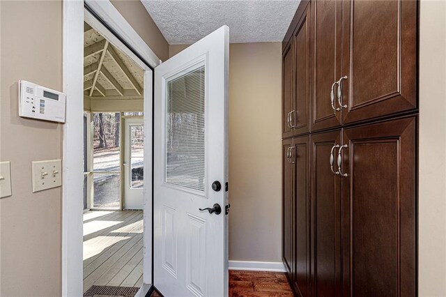 207A Quail Trl, Jackson, GA 30233 - doorway featuring dark wood finished floors and baseboards