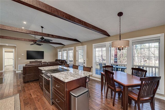 207A Quail Trl, Jackson, GA 30233 - kitchen with electric range, dark wood finished floors, ceiling fan, recessed lighting, and a textured ceiling
