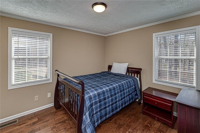 207A Quail Trl, Jackson, GA 30233 - bedroom featuring wood finished floors, a textured ceiling, crown molding, and baseboards