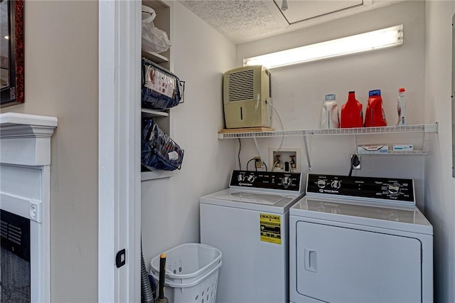 207A Quail Trl, Jackson, GA 30233 - laundry room with separate washer and dryer and a textured ceiling