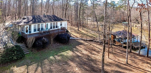 207A Quail Trl, Jackson, GA 30233 - view of front of house with a wooden deck and a view of trees