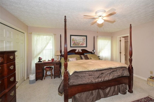 2261 Ravenwood Trl, Marietta, GA 30066 - carpeted bedroom featuring a textured ceiling and ceiling fan