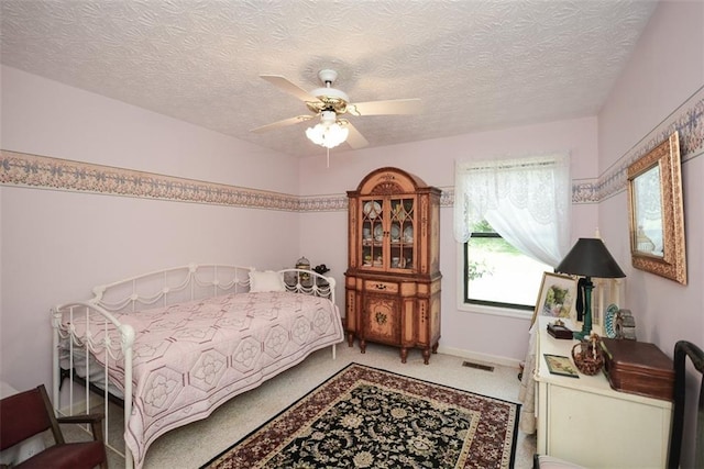 2261 Ravenwood Trl, Marietta, GA 30066 - bedroom with carpet floors, a textured ceiling, and a ceiling fan