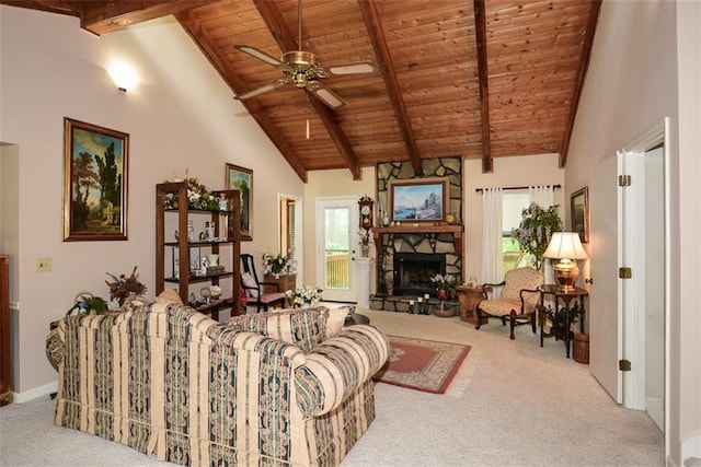 2261 Ravenwood Trl, Marietta, GA 30066 - living room with wooden ceiling with exposed beams, carpet, a stone fireplace, a ceiling fan, and baseboards
